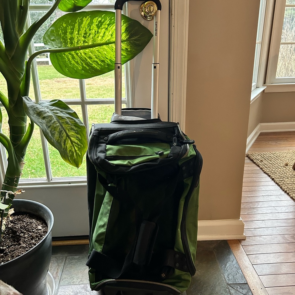 Samsonite Green and Black rolling duffel travel bag